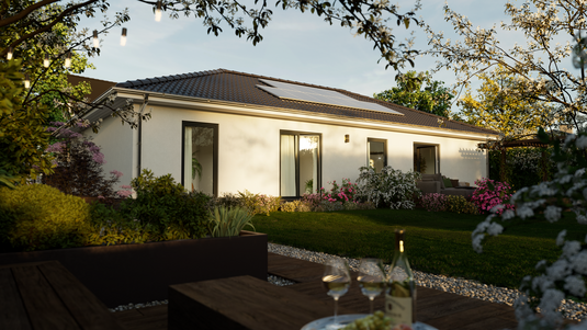 Gartenansicht des Massivhauses Era 131 von Town & Country Haus mit großzügiger Terrasse, bodentiefen Fenstern und moderner Architektur – ein Aktionshaus mit ca. 131 m² Wohnfläche für stilvolles Familienleben.