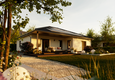 Winkelbungalow 108 aus der Gartenperspektive mit moderner Holzterrasse, geschütztem Sitzbereich und großzügigem Grundstück.